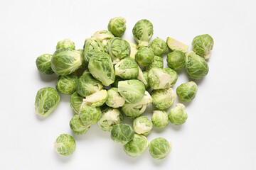 Pile of fresh raw Brussels cabbage on white background
