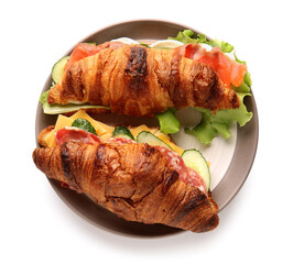Plate with delicious croissant sandwiches on white background