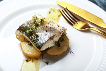 Tasty sea bass fish on plate, closeup