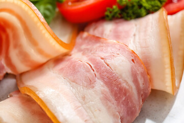 Slices of smoked bacon on table, closeup