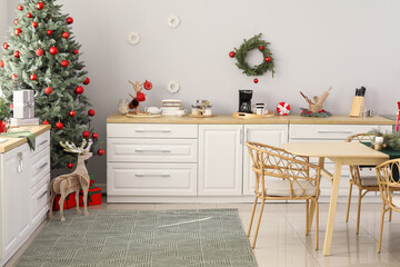 Interior of light kitchen decorated for Christmas