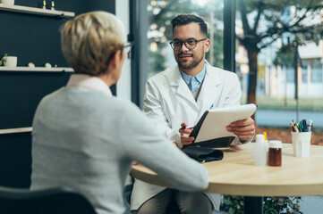 Doctor in consultation with a senior woman patient