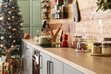 Cooking pot on stove in kitchen decorated for Christmas