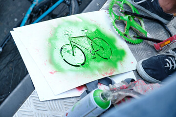Stencil and green paint used to paint bicycles during the Global Climate Strike
