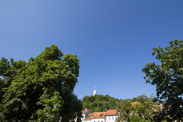 Outlook tower, also called viewing tower or Razgledni stolp, taken from downhill in Ljubljana castle from the city center of the city. The fortress is one of the symbols of Ljubljana