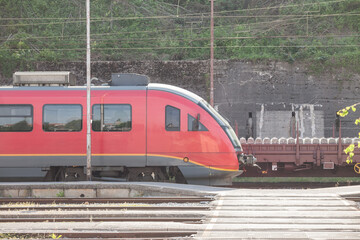 Red train, and EMU electric multiple unit of Slovenian Railways shunting on Ljubljana train station...