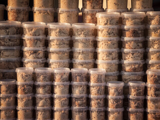 Selective blur on boxes of halva piled, stacked, ready for sale on a market of Serbia, Alva, helva, or halva is a traditional Balkans Turkish confectionery made of semolina and sugar