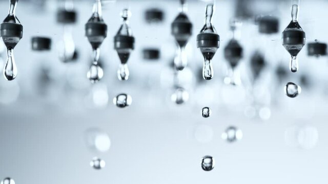 Super Slow Motion Shot of Water Droplets Falling From Shower Head at 1000fps.