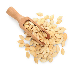 Scoop with natural pumpkin seeds on white background