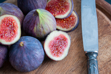 Organic Sweet fig fruit healthy vegan vegetable diet food fresh ripe red cut slide in half tasty...