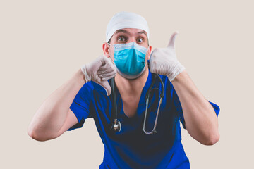 Doctor with thumbs up and down in blue surgeon suit and glasses with stethoscope on the yellow background isolated