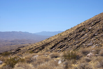 Fototapeta na wymiar Rocky desert mountain area under blue sky near Palm Springs in southern California
