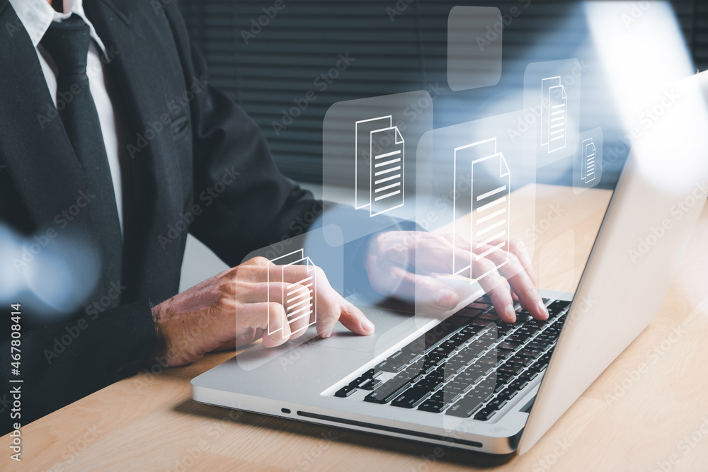 Poster businessman hand using laptop computer with document management icon, document management data syste