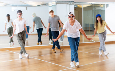 Boy and girls having dancing class in dance studio