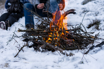 roast sausages on fire at winter