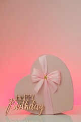 Happy birthday.Pink heart box and inscription Happy birthday on a pink background.Festive pink background
