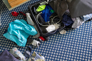 Messy laundry from suitcase
