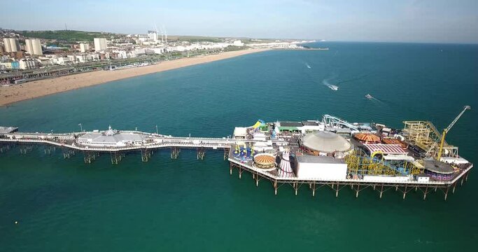 Aerial view of new Brighton pier with active fun park in Brighton Great Britain