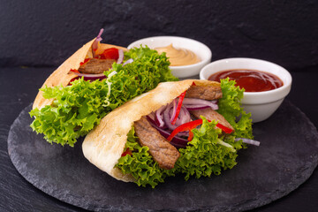 Pita with salad , paprika and beef meat