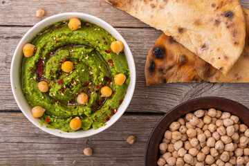Declicious food from chickpea - green hummus