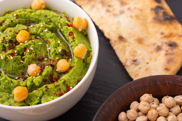 Declicious food from chickpea - green hummus