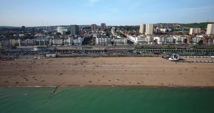 Aerial view of Brighton beach full of people in England