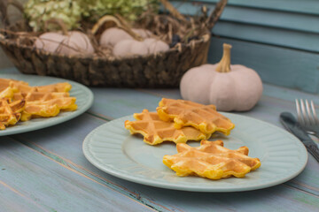 Viennese pumpkin waffles on an old wooden table.