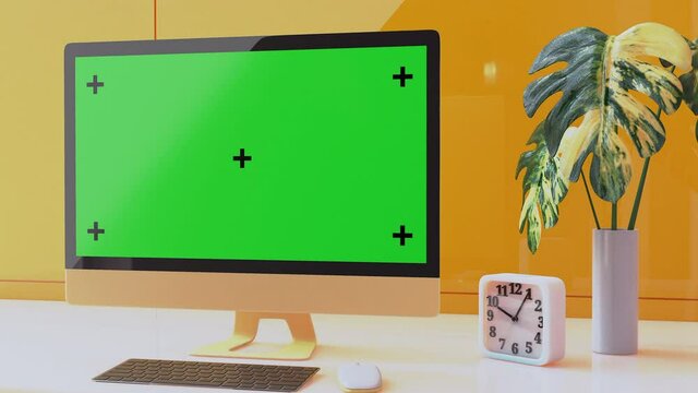 Yellow computer monitor on white desk with clock and trees in the yellow office. Monitor motion graphic Mock-up Yellow color 4k. technology  idea concept. 3D render.