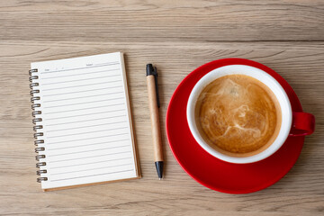 blank notebook and coffee cup on wood table. Motivation, Resolution, To do list, Strategy and Plan concept