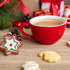 Merry Christmas with homemade cookies and coffee cup on wood table background. Xmas eve, party, holiday and happy New Year concept