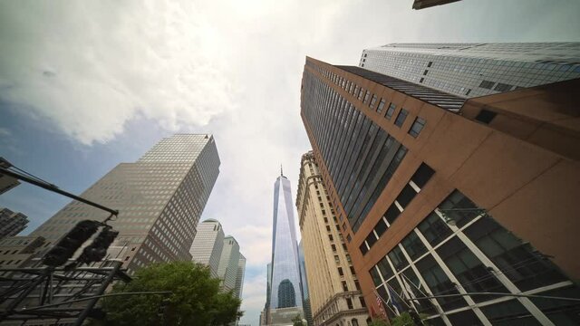 Looking up dolly shot of Manhattan skyscraper buildings in New York City. NYC is financial, economic and business center of America.