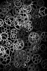 Cogs and watch pieces on black background