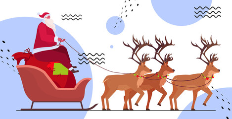 santa riding in sledge with reindeers happy new year merry christmas winter holidays celebration concept