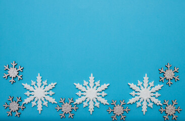 Christmass flatlay white snowflakes in shape frame 