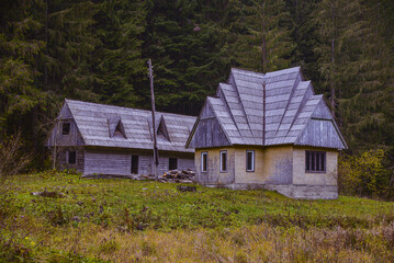 ethnic wooden house in autumn in the mountains