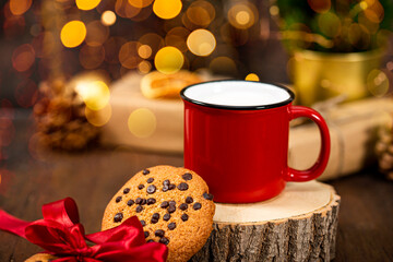 Red cup of milk and cookies for Santa Claus. Christmas treat for Santa