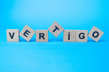 vertigo word written in wooden letters 