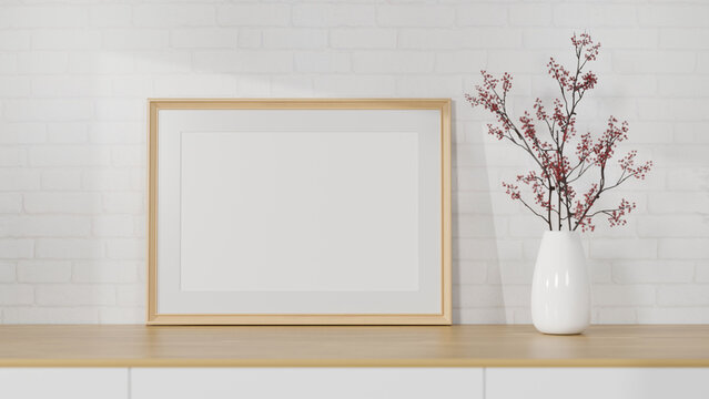 Mockup horizontal wooden picture frame on wood table with minimal flower vase