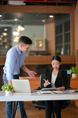 Businessman giving the campaign feedback to his project marketing female manager