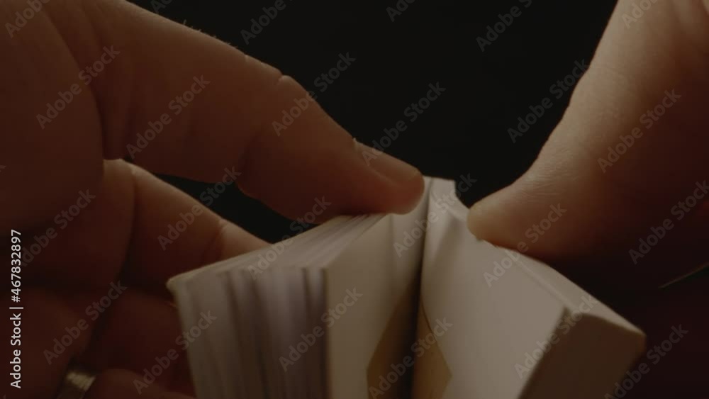 Poster a small book being opened and the pages flipping a small push on the camera