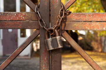 Old Padlock and Rusty Steel Metal Chain.