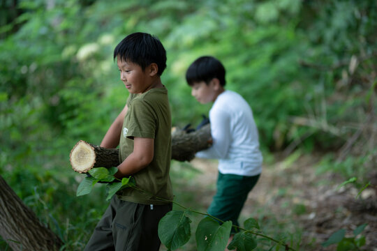 Children Carrying Log
