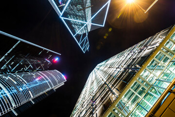 Low-angle view of modern office skyscraper buildings in central, Hong Kong.