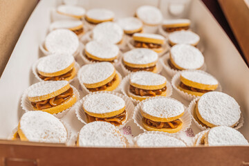 Box with a group of candy individual pastries in a bakery