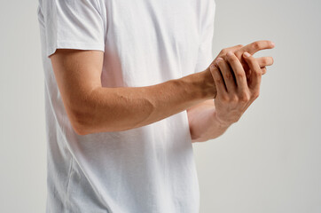 man holding hand injury health problem