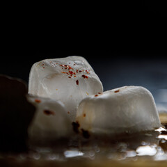 closeup of ice cubes sprinkled with spices