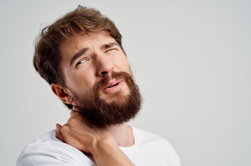 Obraz premium emotional man pain in the neck health problems massage therapy studio treatment