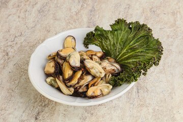 Tasty marinated mussels in the bowl