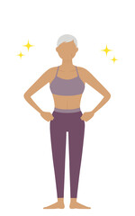 腰に手を当てて立つスポーツジムインストラクターのシニア女性