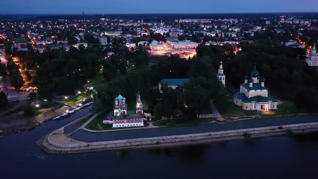 Flight over evening city of Uglich and Epiphany Cathedral on the banks of Volga River